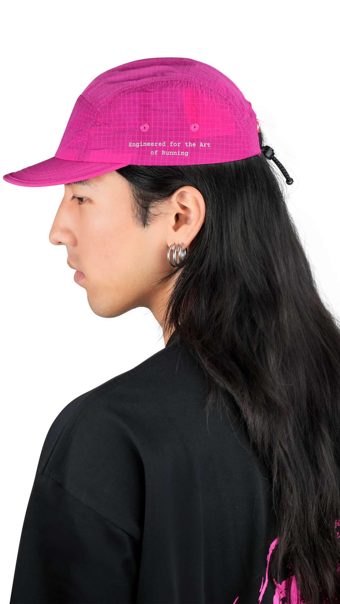 Lievre Running pink performance running cap, lightweight technical fabric with adjustable back cord and “Engineered for the Art of Running” text on the side panel.