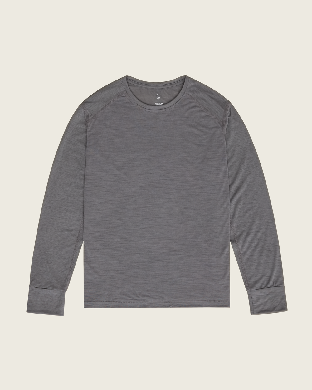 Men’s merino long-sleeve running top in Slate from Sysum, lightweight knit visible, photographed in a neutral studio setting.